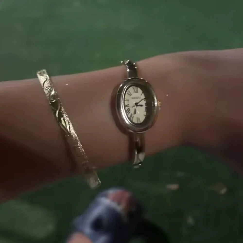Anthropologie Gold Oval Bangle Watch with White Dial
